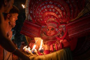 Looking in to the mirror before Theyyam Performance